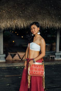 "If you're into luxe casual or softer bohemia, This bag is a must in your closet! It is made with an amazing piece of fabric woven by the HMONG hill tribes of Lanna Region (Northern Thailand). It features gold metallic leather, cotton lining and a zipper closure. Hook it up with any stunner from your boho chic wardrobe. We buy materials from Hmong market and we design and sew by hand. Some of the bags we modify to improve the product. The Hmong tribes live in the North of Thailand and have origi Red Bohemian Rectangular Bucket Bag, Bohemian Red Rectangular Bucket Bag, Hippie Woven Festival Bags, Bohemian Pouch Bag For Festival, Bohemian Festival Pouch Bag, Hippie Handwoven Shoulder Bag For Festivals, Hippie Festival Handwoven Shoulder Bag, Traditional Bucket Shoulder Bag For Festival, Red Bohemian Bucket Bag For Travel