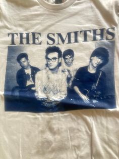 a white shirt with the smiths on it