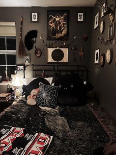 a bed room with a neatly made bed and pictures on the wall