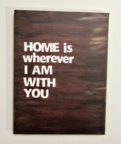 a piece of art that says home is wherever i am with you on the wall