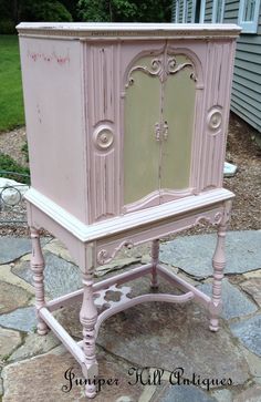 an old dresser painted pink with white trim