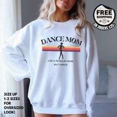 Get your groove on with our Retro Rainbow Dance Mom Sweatshirt! This vibrant, stylish shirt is perfect for competition day for dance moms, featuring a dance studio-inspired design. Embrace the dance mom life in comfort and style with this unique and trendy gift. Ideal for Mother's Day, mom's birthday, holiday gift for mom or any occasion. Ideal for any situation, a unisex heavy blend crewneck sweatshirt is pure comfort. These garments are made from polyester and cotton. This combination helps de Dance Parent Shirt Ideas, Dance Mom Competition Shirt, Dance Sweater, Dance Mom Sweatshirt, Dance Mom Era Svg, Retro Dance, Dance Mom Shirt, Women Dance, Rainbow Dance