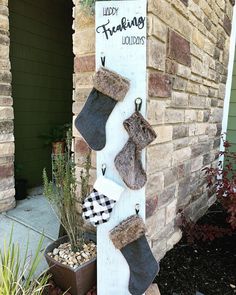 stockings hanging on the side of a brick building