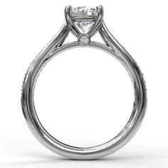 a white gold engagement ring with a princess cut diamond on the center and side stones