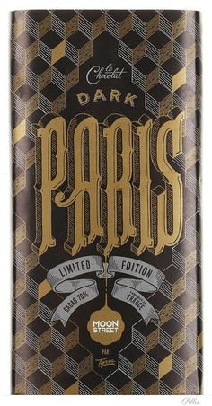 a dark chocolate bar with the word paris on it's front and gold lettering