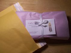 two envelopes wrapped in yellow and purple paper