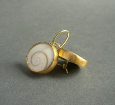 "Timeless and stylish, these pretty earrings are beautiful for daytime as well as evening wear. In their simplicity, these earrings make a sculptural, contemporary statement. A pair of slightly domed operculum shells are bezel set in a combination of 22-karat gold and 18-karat gold. The gold has a matte/brushed finish. These hand made earrings measure about 1/2\" in diameter and 7/8\" from top of the ear wire to the bottom of the earrings. In millimeters, the earrings measure about 13 mm in diam 22k Gold Earrings, Golden Spiral, Earrings Golden, Swirl Earrings, Golden Ratio, Spiral Earrings, Pretty Earrings, How To Make Earrings, 22k Gold