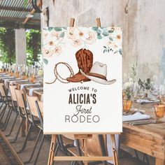 an easel with a sign that says welcome to alicia's first rodeo