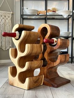 Dimensions  HxWxDcm:  No.1: 53.5x33x24 cm  No.2: 49x25x17.5 cm  The wine rack made of solid wood impresses with its elegant and timeless design, which will be an absolute highlight in your home. Each of our wine racks is handmade, making each piece unique and highlighting the individual beauty of the acacia wood. Wood Wine Holder, Countertop Wine Rack, Wood Bottles, Wooden Wine Rack, Wine Bottle Rack, Wood Rack, Wood Wine Racks, Bottle Rack, Wine Holder