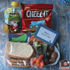 the lunch box is packed with snacks and other items to be eaten by someone else