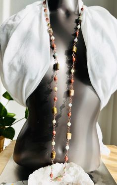 This beautiful, handmade necklace is sure to turn heads wherever you go! Crafted with jasper and goldstone, its adjustable up to 40-inches length makes it perfect for any occasion - whether you want to rock a choker, or just drape a stunning strand around your neck. Wrap it around your wrist for an unexpected bracelet - the possibilities are endless! Adjustable Single Strand Agate Jewelry, Adjustable Agate Necklace For Festivals, Unique Lariat Necklace With Natural Stones, Lariat Necklace With Natural Stones For Healing, Spiritual Beaded Copper Necklaces, Handmade Agate Lariat Necklace, Long Natural Stones Necklace For Festival, Bohemian Agate Lariat Necklace, Healing Lariat Necklace With Natural Stones