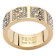 Elevate Your Style With The Iconic F Is Fendi Wide Band Crystal Ring, Featuring Engraved Letters On Gold-Finish Metal. This Classic Ring Includes Engraved Decoration In The F Is Fendi Shape And Decorated With Natural Crystals. Fashion-Forward And Elegant, This Ring Makes The Perfect Finish For Any Outfit. Gift This Gorgeous Ring Or Add It To Your Personal Designer Collection, Only From Fendi. Model: 8ah399 Size: Small (Us Size 5.5) Gold-Finished Metal Ring With Engraved With Ff Logo Decorated Wi Prada Rings, Crystals Fashion, Engraved Letters, Fendi Jewelry, Ff Logo, Gorgeous Ring, Crystal Ring, Metal Ring, Classic Ring