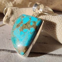 "Natural High Grade Arizona Kingman Turquoise Freeform Handmade .925 Sterling Silver Pendant 1 3/4\" x 1 3/8\" weighing 10 grams GC47. This is a handpicked natural stone, the exact one shown in picture.  The sterling silver is .925 and stamped.  Each piece is hand made by artisans in my shop. The quality of the stones and the silver workmanship is impressive.  Please look at other items in my store.  I sell ready-made jewelry with hand crafted silver work, pendants with a sterling silver bails a Collectible Blue Turquoise Gemstone Necklace, Collectible Turquoise Sterling Silver Necklace, Kingman Arizona, Turquoise Boho, Arizona Turquoise, Boho Pendant, Natural High, Silver Work, Kingman Turquoise