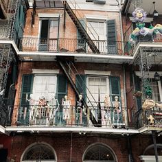 an apartment building with many balconies and iron railings