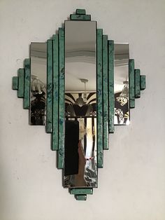 a mirror mounted to the side of a wall