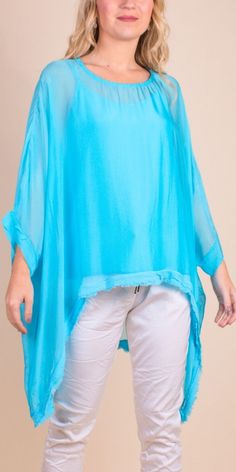 2 Piece High-Low Silk Kaftan Featuring a Raw Edge Bottom Hemline. Exterior 100% Silk Interior 95% Viscose, 5% Elastic One Sizes Fits Most Made in Italy Model 5'7 Summer Tunic Blouse For Layering, Solid Color Summer Tunic Top, Oversized Rayon Summer Blouse, Spring Layering Tunic Top, Stretch Solid Color Blouse For The Beach, Rayon Tunic Top For Vacation, Beach Tunic Top In Rayon, Solid Color Flowy Rayon Tops, Flowy Solid Rayon Tops