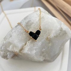 We think this is the year for expressing self-love. Wear our Little Black Heart Necklace as an expression that you're actively working on loving who you are in the now. Look closely and you will see that the heart is comprised of 3 separate pieces, your past, your present, and your future. Gold plated charm on 14kt gold fill chain. Heart charm measures approximately 1/2 inch. Black Heart Necklace, Puffy Heart Charms, In The Now, Diamond Initial Necklace, Chain Heart, Hand Necklace, Rose Gold Chain, Puffy Heart, Black Heart