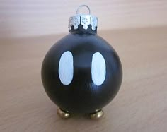 a black ornament sitting on top of a wooden table