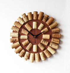 a clock made out of wine corks on the wall