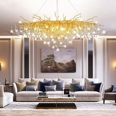 a living room filled with furniture and a chandelier hanging over the top of it