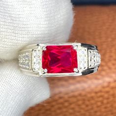 This Ring is made of Lab Ruby 7x9mm Gemstone, The Metal Is 925 Sterling Silver and also available in 10k,14k, 18k Solid Gold.(Yellow Gold, White Gold and Rose Gold) Ruby Men's Ring,925 Sterling Silver/14k Solid Gold Engagement Wedding Ring For Mens,7x9mm 4ct Princess cut Red Gemstone Ring, Male Gift Ring July Birthstone, white/ Yellow/ Rose Gold ring Product Details: - Material:- 925 Sterling Silver/10k/14k/18k Solid Gold Main Stone:-Lab Ruby Stone size:- 7x9mm (Princess Cut) Stone Weight :-  4 Mens Ruby Ring Silver, Ruby Ring For Men In Gold, Formal Red Ruby Ring With Rectangular Stone, Red Radiant Cut Ring With Center Stone, Red Radiant Cut Ring For Anniversary, Red Radiant Cut Ring With Prong Setting, Gia Certified Red Promise Ring, Classic Red Ruby Ring With Square Cut, Fine Jewelry Red Rings With Rectangular Stone