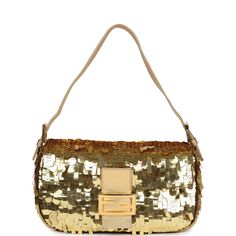 This vintage Fendi baguette bag is in gold fabric covered in different shaped sequin paillettes with small gold beading around the edge of the bag and features a front flap snap closure, and an adjustable gold leather shoulder strap.The interior is lined in orange/red satin fabric and has one zippered pocket on the rear wall with a gold zipper pull.Origin: ItalyCondition: Vintage; Excellent - This bag retains it shape. There's some light scratching to hardware. The exterior fabric has some missi Vintage Fendi Baguette, Red Satin Fabric, Fendi Baguette Bag, Fendi Shoulder Bag, Vintage Fendi, Ff Logo, Fendi Baguette, Baguette Bag, Gold Fabric