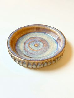 a blue and white bowl sitting on top of a table