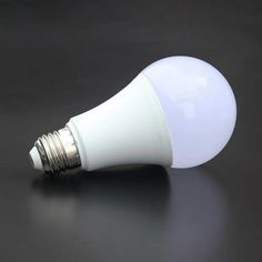 a white light bulb sitting on top of a table