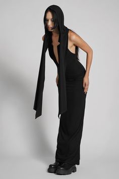 Make them take a second glance. Maxi dress made from luxuriously dense Jersey, featuring an add-on hood that can be draped across the shoulders and over the crown of the head, with plunging halter top neckline. FIT NOTES:Tatianna wears a size Small, 5'9, with a 26" waist.MATERIALS:95% rayon 5% spandexMade in China Hood Dress, Top Neckline, Low Neckline, The Crown, Halter Top, Dress Making, Take That, Crown, Maxi Dress