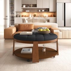 a living room filled with furniture and a large open space kitchen in the back ground