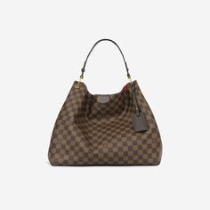 That perfect, practical, stylish and spacious tote you’ve been looking your whole life for? Look no further, hun. Crafted from the brand’s signature Damier Ebene canvas, Louis Vuitton presents the Graceful hobo bag – the extra-roomy yet lightweight bag you won’t be able to live without. Whether you’re travelling, packing an overnight bag, carrying your laptop and binders to work, or just enjoy bringing your whole entire world with you wherever you go, then this is the bag for you.  SPL Exterior  Damier Ebene canvas Brown calfskin leather trims  Gold-tone hardware Brown leather shoulder strap Leather tag  Magnetic closure  Immaculate condition - minor fabric frays and marks to the strap    Interior  Red fabric lining  Spacious compartment Zip pocket Louis Vuitton embossed leather logo tag I Louis Vuitton Presents, Leather Tag, Lightweight Bag, Logo Tag, Dior Shoes, Damier Ebene, Brown Canvas, Timeless Handbag, Leather Logo