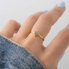 Beautiful, and dainty heart ring. - - - D E T A I L S - - - * Made of 925 Sterling Silver * Available in 14k Gold or Rhodium Plated * We use a THICK plating of 14k Gold for a piece that is sure to last years to come * Nickel-free & Hypoallergenic * WILL NOT TURN FINGER GREEN! * Available in Sizes 4, 5, 6, 7, 8, 9, or 10 * Ring Measurements: Heart: 7mm WIDTH: 1.3mm Ring Sizer- https://www.etsy.com/listing/1240904225/ring-sizer-reusable-ring-sizer-plastic?click_key=b5e074cfb419bcfddc2d9f2ce4b2f537 Simple Heart-shaped Stackable Promise Rings, Simple Heart-shaped Midi Promise Ring, Minimalist Heart Shaped Stackable Promise Rings, Dainty Heart-shaped Stackable Rings For Anniversary, Minimalist Heart Ring With Open Heart Charm, Dainty Heart-shaped Stackable Anniversary Rings, Minimalist Open Heart Ring With Heart Charm, Minimalist Heart Shaped Stackable Rings For Anniversary, Minimalist Heart-shaped Stackable Rings For Anniversary