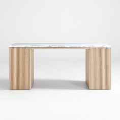 a white marble top table with wooden slats