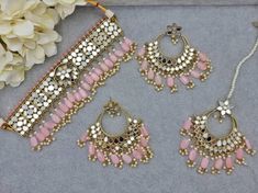 Gorgeous Sheesha and American Diamond CZ Work Choker Necklace set, comes with Earrings and Tikka, and Detailed Pearl Drop. Jewelry Care -- Keep all the jewelry away from water, perfumes, and other harsh chemicals To clean wipe with a lint-free cloth to retain the shine Please Note- No Returns No Exchange Pink Jewelry Sets For Diwali Party, Pink Round Jewelry Sets For Diwali, Pink Meenakari Jewelry For Eid, Festive Pink Jewelry Sets, Pink Festive Jewelry For Eid, Festive Pink Jewelry For Eid, Festive Pink Round Jewelry Sets, Pink Jewelry With Latkans For Eid, Pink Round Kundan Necklace For Diwali