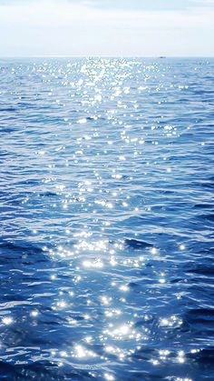 the sun shines brightly on the water as it reflects off the ocean's surface