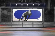 a billboard with an image of a man doing push ups on it's side