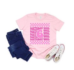 6th Birthday Girl Shirt, Girl 6th Birthday Tee, Checker Wavy Design T shirt, Girl Birthday Shirt, 6 Years Old Shirt, Girl Birthday Gift  Your Shopping Guide:  - *Select the Perfect Size:* We recommend checking our detailed measurements to guarantee the ideal fit. If you need assistance with at-home measurements, our product listings include instructions. - *Choose Your Style:* Explore a spectrum of colors and designs to find the perfect one. If you have a specific color preference, please provid Pink Number Print T-shirt For Birthday, Pink Short Sleeve T-shirt With Number Print, Pink Graphic Print Shirt For Birthday Gift, Pink Graphic Print Shirt As Birthday Gift, Casual Pink Shirt For Birthday, 6th Birthday Girl Shirt, 6th Birthday Girl, 6th Birthday Girls, Wavy Design