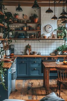 a kitchen filled with lots of wooden furniture next to a wall mounted clock and potted plants