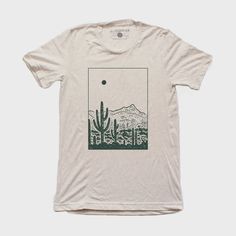 DescriptionThe Desert Tee is a screen-printed t-shirt with black water-based ink. Screen printed with care in Denver, Colorado using eco-friendly manufacturing processes to minimize their ecological footprint. Material52% Cotton, 48% Polyester. FitTrue to size, men's / unisex crew fit About Moore CollectionMoore Collection is founded by high school sweethearts Taylor and Tanner Barkin. They are self-taught in the art of screen printing, and what began as a fun hobby for in high school quickly ev Screen Print Designs Shirts, Outdoorsy Graphic Tees, Unisex Tshirt Design Graphic Tees, Nature T Shirt Design, Screen Printed T Shirt, Organic Cotton Crew Neck Shirt With Screen Print, Hand Printed Organic Cotton T-shirt, Hand Printed Graphic Tee With Short Sleeves, Hand Printed Crew Neck Graphic Tee