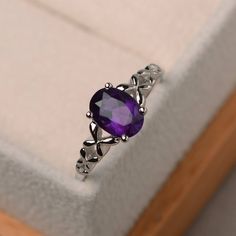 This ring features a 6*8 mm oval cut natural amethyst ,and sterling silver finished with rhodium. Customization is available. It is made by hand, and it will take about 7 days to finish the ring after your payment is completed. Main stone: natural amethyst Main stone weight: Approx 1.14 ct Metal type: sterling silver finished with rhodium Accent stone: none Customization is available, I also can make it with 14k solid gold (white or yellow or rose) and diamond accent stone, just feel free to con Butterfly Engagement Ring, Wedding Ring Oval, Oval Amethyst Ring, Purple Amethyst Ring, Purple Rings, Amethyst Jewelry, February Birthstone, Unique Diamonds, Ring Oval