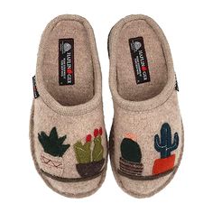 a pair of slippers with embroidered cactus and succulents on the side