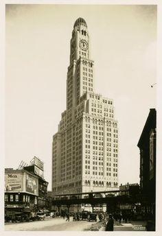 an old black and white photo of a tall building