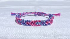 Cheap Casual Purple Friendship Bracelets, Purple Beaded Friendship Bracelet With Sliding Knot, Casual Purple Friendship Bracelets As Gift, Casual Purple Friendship Bracelets With Sliding Knot, Casual Purple Friendship Bracelets For Beach, Casual Purple Friendship Bracelets, Pink Woven Friendship Bracelets For Beach, Casual Pink Braided Friendship Bracelets, Pink Adjustable Braided Bracelet For Friendship