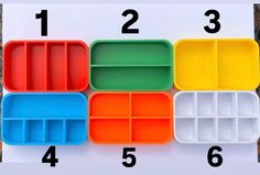 four different colored trays with dividers on them and numbers in the bottom row