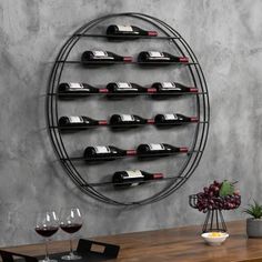 a wine rack is mounted on the wall next to a table