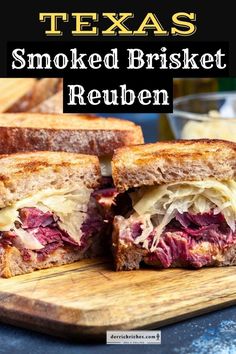 a close up of a sandwich on a cutting board with the words texas smoked brisket reuben