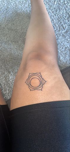 a woman's lower leg with a tattoo on her left side and the bottom half of her legs