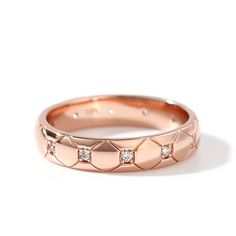 a rose gold ring with diamonds on it