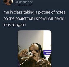 a man taking a photo with his camera and texting it's me in class taking a picture of notes on the board that i know i will never look at again