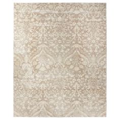 a beige and white rug with an intricate design on the bottom, in front of a white background